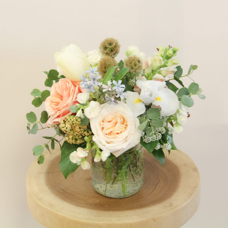 Neutral and pastel flowers in a mini vase