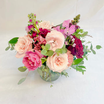 Valentine small arrangement with roses, tulips, spray roses, ranunculus and more sure to bring a smile to anyone this Valentine. Delivery and pick up in Houston