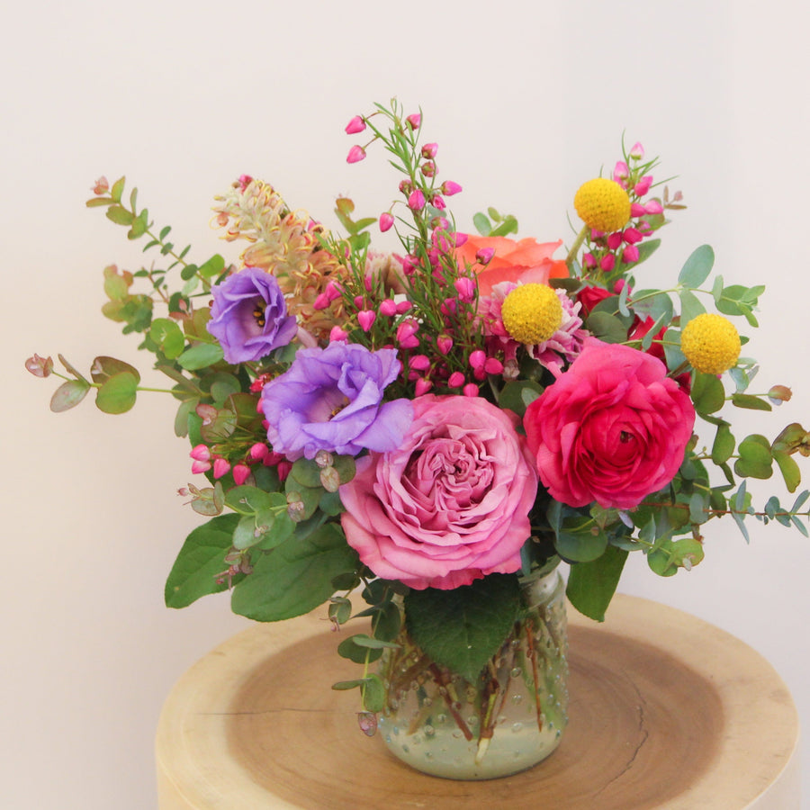 The mini arrangement is a cheerful joy for your special person.